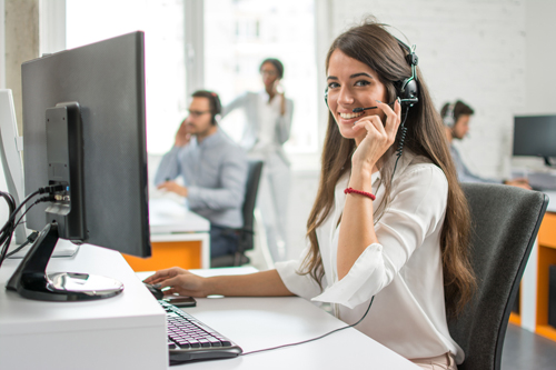 Woman with telephone headset helping a customer